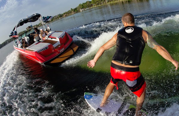 Wakesurfing behind a Nautique