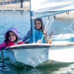 two girls sailing in a sabot