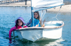 two girls sailing in a sabot