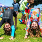 two campers doing backbends