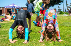 two campers doing backbends